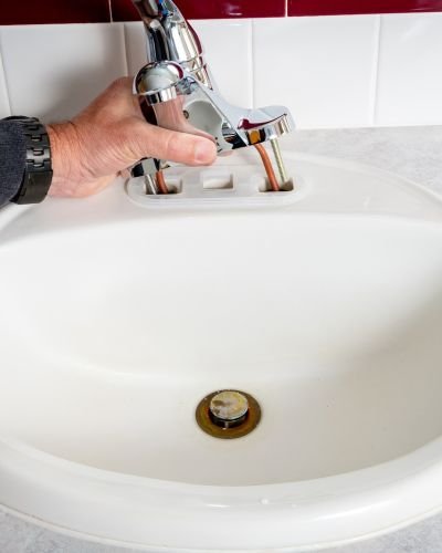 Hand Turning Faucet In Kitchen Sink For Water Flow Tampa Fl
